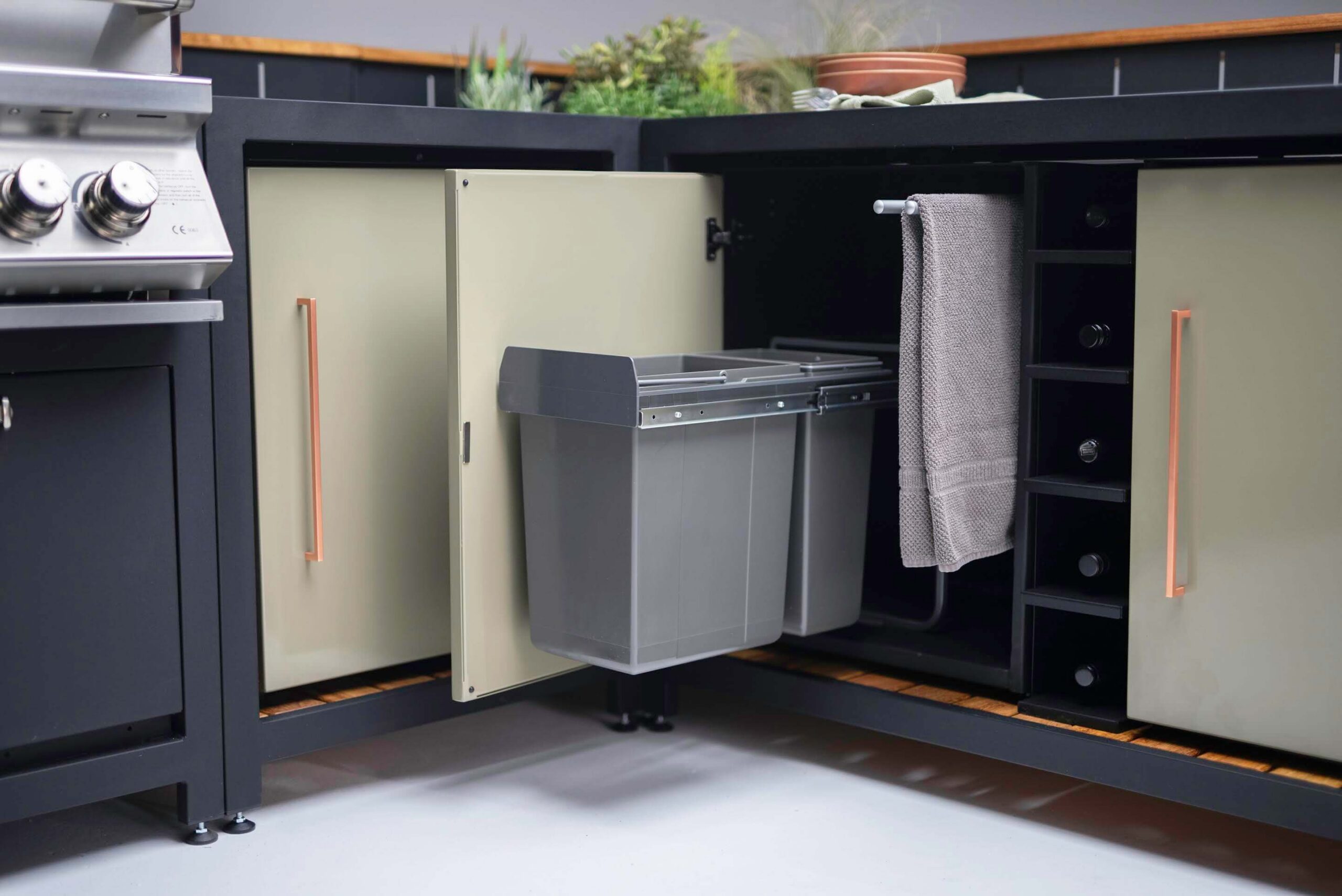 Waste bin cabinet in a vibe corner setup